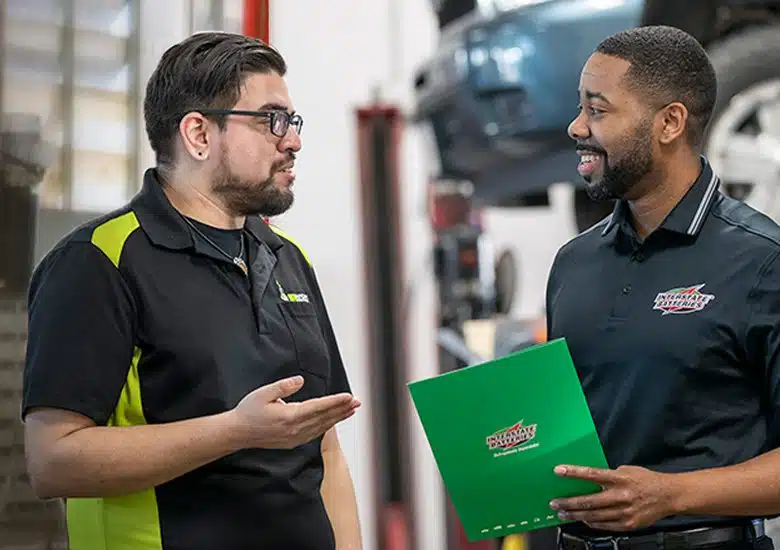 Interstate Batteries rep talking with business client